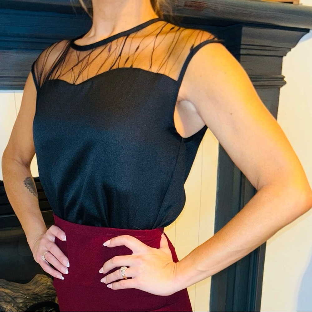 Fitted Black Sleeveless Blouse with Embellished Sheer Neckline